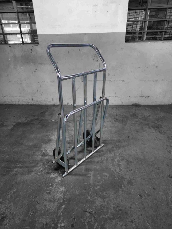 Stackable chrome flatbed trolley in upright closed position for easy storage
